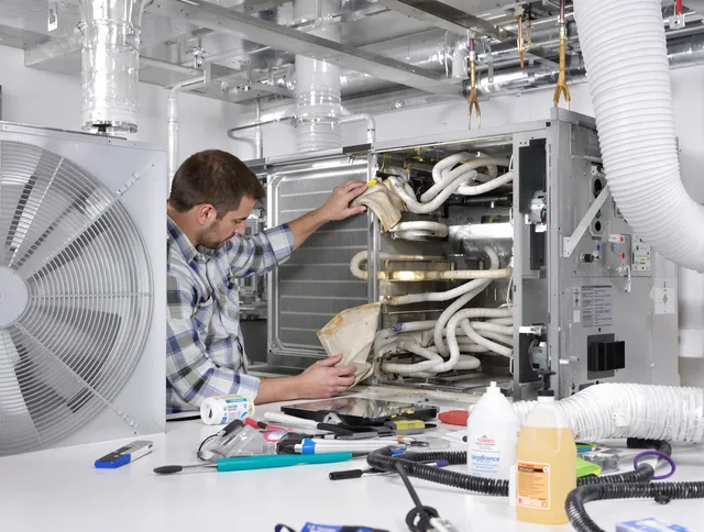 Dartmouth Air Duct Cleaning specialist performing precision AC coil cleaning in Dartmouth
