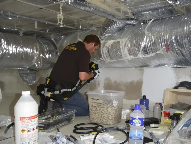 Dartmouth Air Duct Cleaning specialist performing professional mold removal from air ducts in Dartmouth