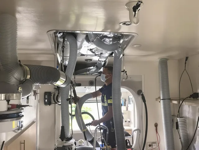 Dartmouth Air Duct Cleaning specialist performing precise mobile home duct cleaning in Dartmouth