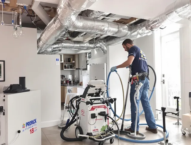 Dartmouth Air Duct Cleaning technician performing advanced pure duct cleaning with specialized equipment in Dartmouth