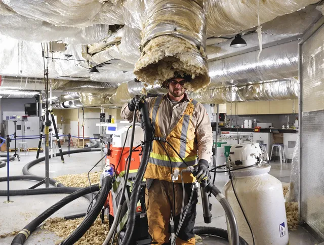 Professional vacuum insulation removal by Dartmouth Air Duct Cleaning expert in Dartmouth